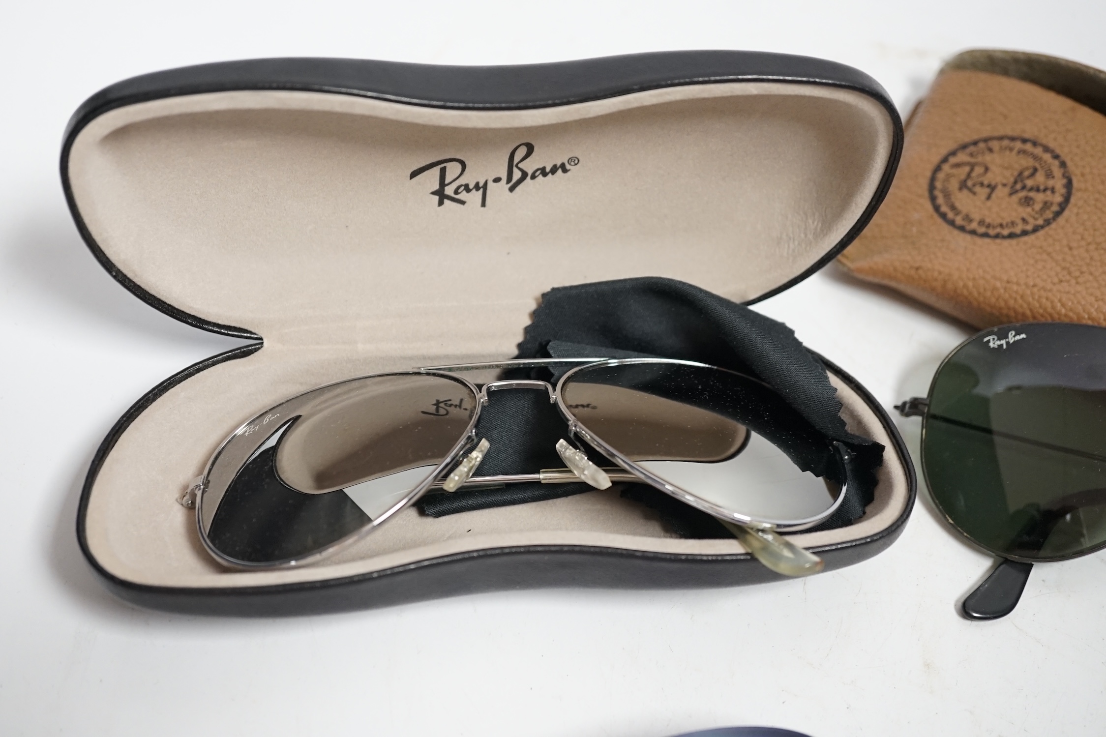 A collection of vintage Ray-Bans and other sunglasses